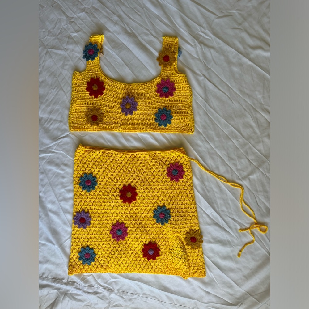 Crochet set in yellow size medium with flowers appliqué on front and back.